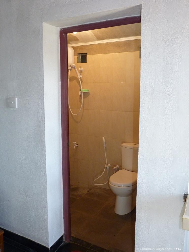 attached bathroom with hot water